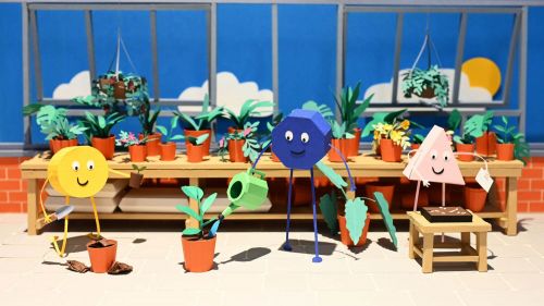 A selection of paper shape characters in a gardening scene. 